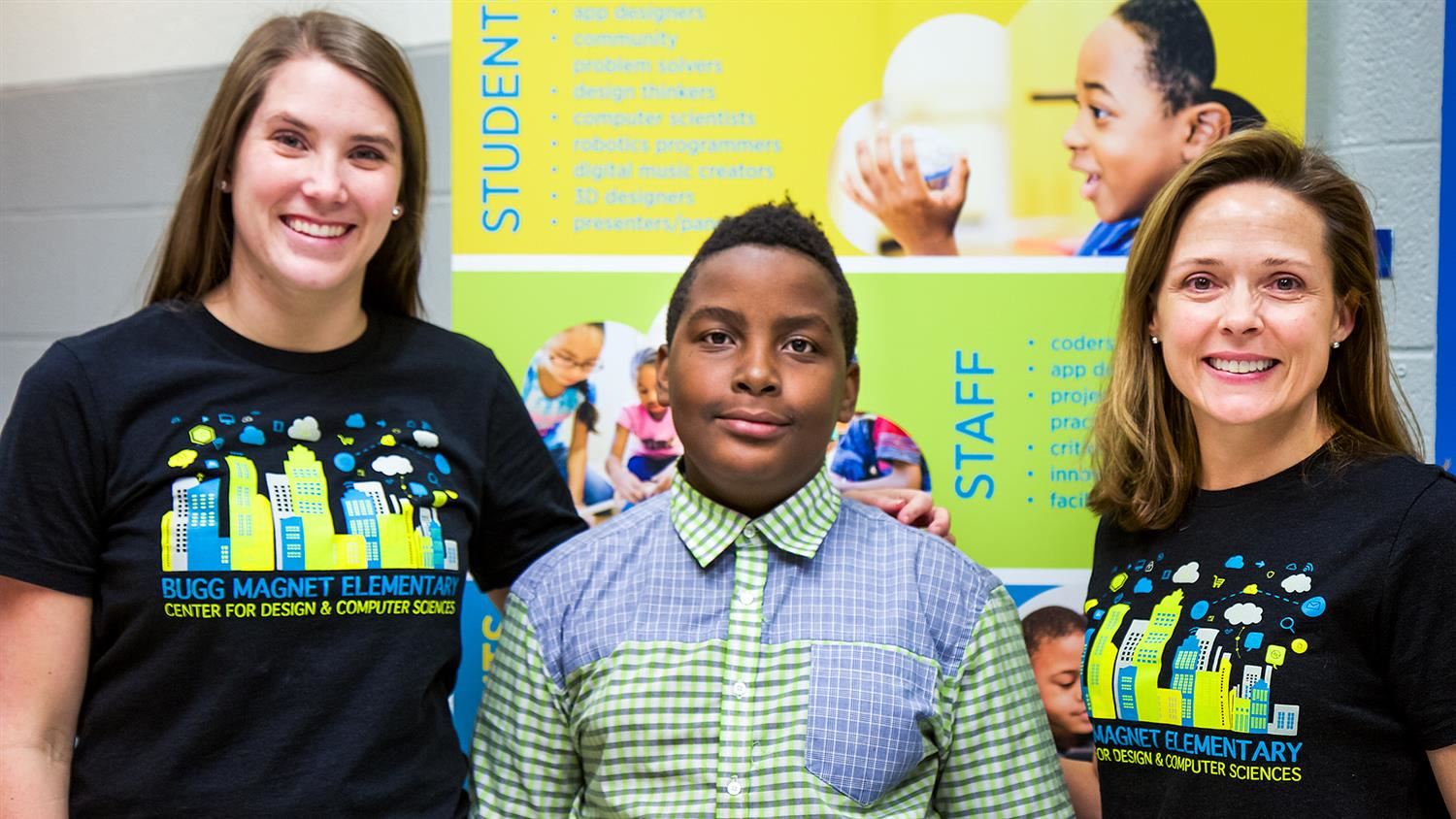 Bugg Elementary student Teddy Katanta and two of his teachers 
