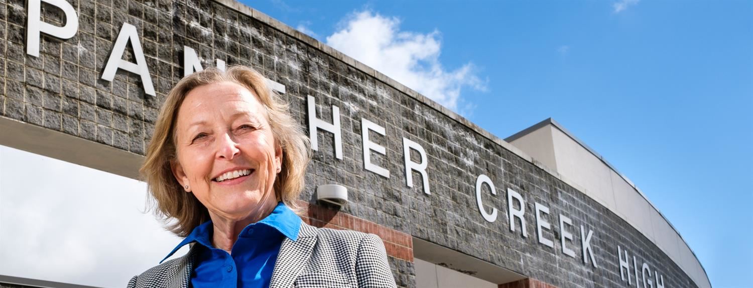 Camille Hedrick in front of Panther Creek HS 