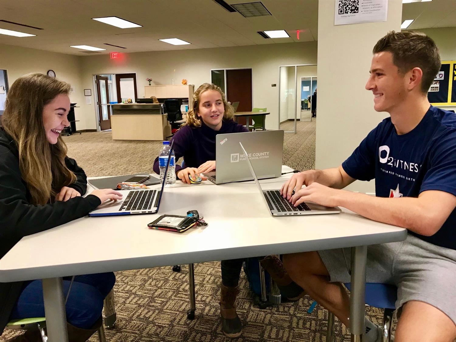 Crossroads FLEX senior George Marks working in class with fellow students 