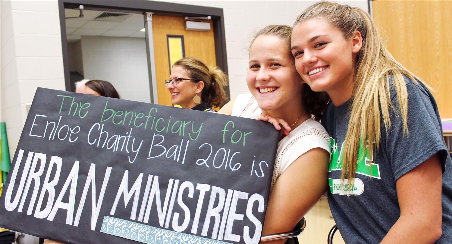Enloe students with Charity Ball sign 