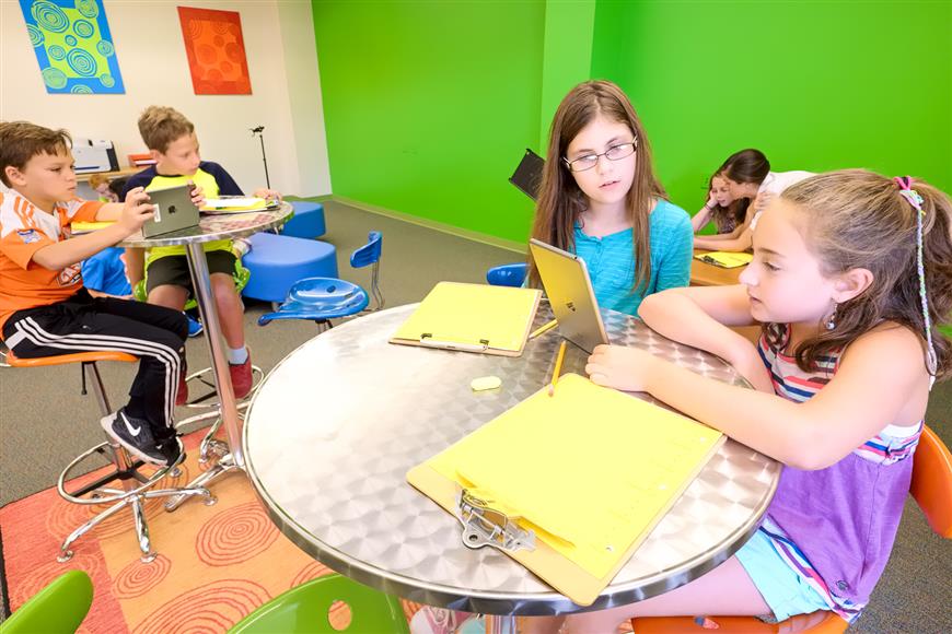 Sycamore Creek Elementary students work in teams with iPad minis during science instruction. 