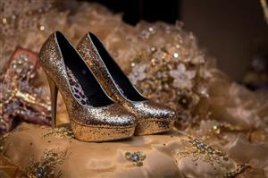 Gold sparkly high heels on gold dress