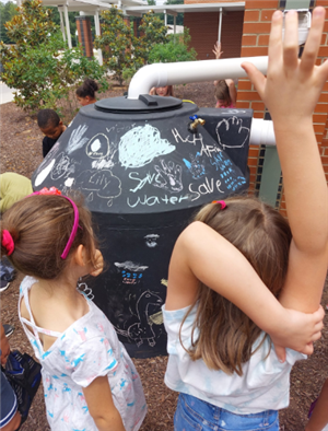 Students observing the cistern. 