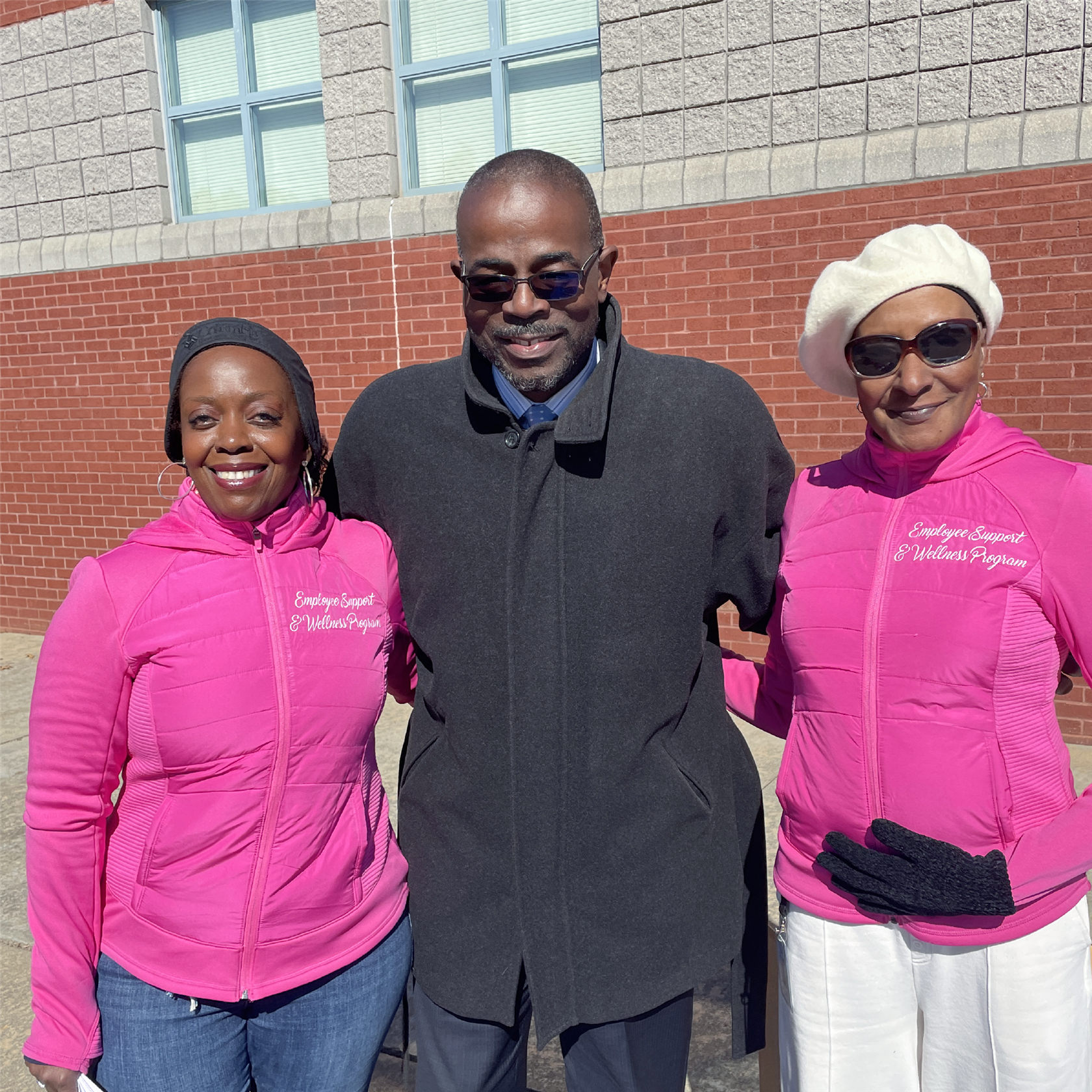  Dr. Taylor smiling with staff at Wakesgiving