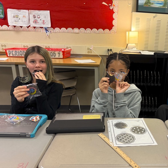  Students enjoying Pi Day activities in math class